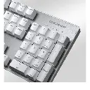 Gros plan sur le pavé numérique d'un clavier mécanique Cougar Ultimus EX blanc avec châssis en acier brossé pour setup gamer FlowUP