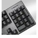 Gros plan sur le pavé numérique d'un clavier mécanique Cougar Ultimus EX noir avec châssis en acier brossé pour setup gamer FlowUP
